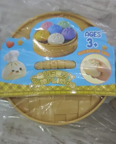 Recalled GIHNJSI Squeezy Dumplings packaging with removable label - front