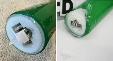 Recalled Light-Up Foam Stick (Item No. SS041-M) – End of stick showing accessible button cell batteries