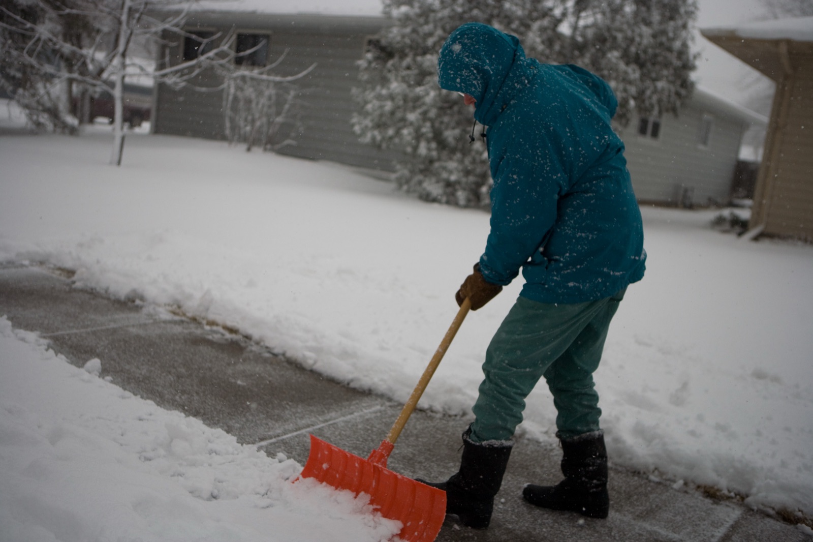 A snowy residential street during a winter storm