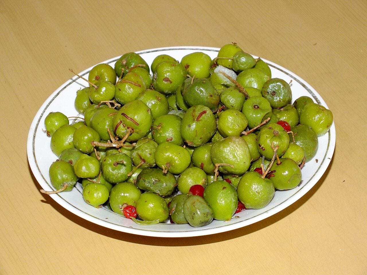 A plate of small green kiwi berries
